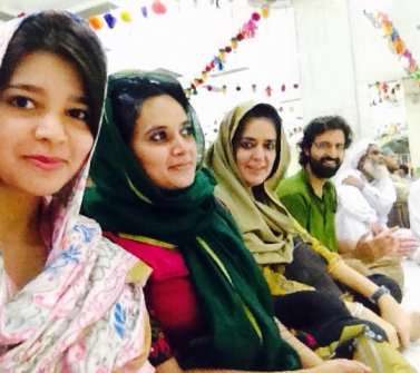Smriti, Shabnam and Vipul with a student volunteer at a dargah in Lahore